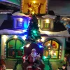 La maison et le Père Noël sur son trône – Musical