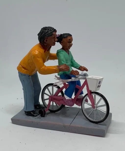 Personnage avec enfant Vélo